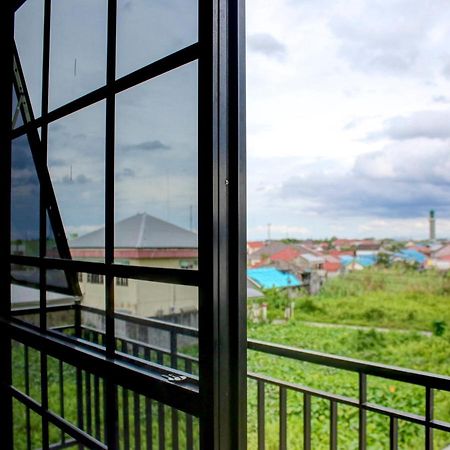 Oyo 90162 Remboelan Guest House Sungai Lutus 外观 照片